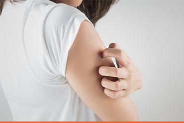 person scratching right shoulder